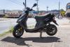 black_moped_side_view_moped_rental_company.jpg